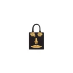Schiaparelli Mini Anatomy Jewelry Bag in black velvet featuring gold nose and mouth hardware (Face Bag) Schiaparelli Mini Anatomy Jewelry Bag in black velvet featuring gold nose and mouth hardware (Face Bag)