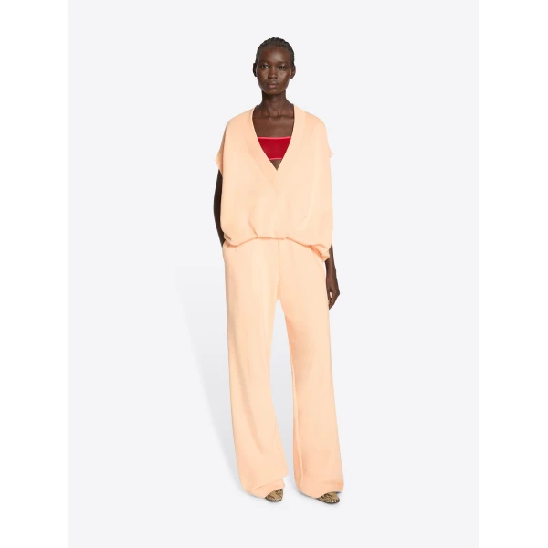 with pleats towards the hemline.