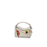 LOEWE-Puzzle-10-Joe-Brainard-re-edition-in-classic-calfskin-2025-coveti-scaled73483_nobg LOEWE Puzzle Bag luxury Bags from Luxury Handbags Marketplace