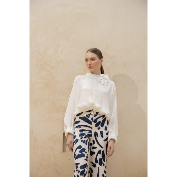 Andres Otalora luxury designer Top with bold silhouette in linen
