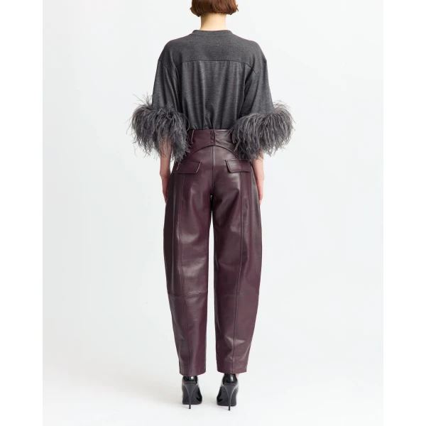 Piped seams run along the front and back