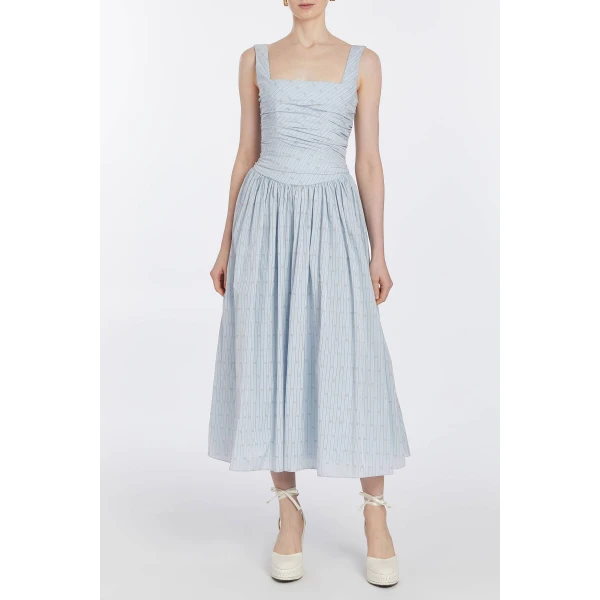 Markarian dresses with romantic neckline and structured silhouette