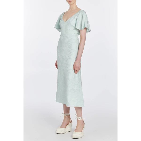 Markarian dresses with romantic neckline and structured silhouette