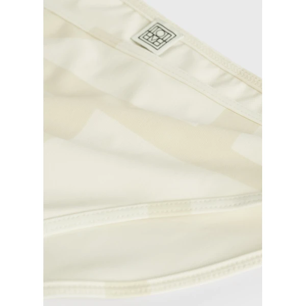 Toteme Beachwear with minimalist design at Luxury Shoes 