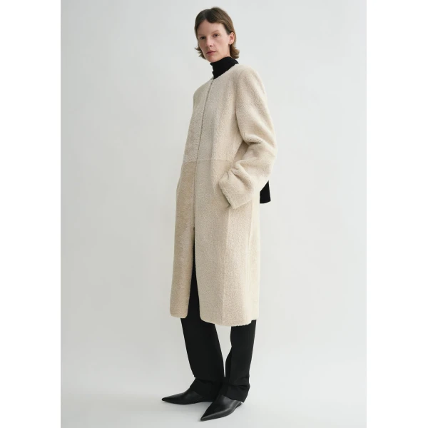 Toteme Coats with minimalist design at Luxury Shoes 