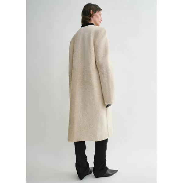 Toteme Coats with minimalist design at Luxury Shoes 