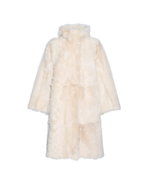 Woman wearing Yves Salomon shearling fur coat – luxury outerwear at Luxury Shoes 