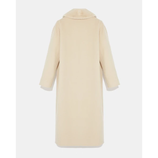 Woman wearing Yves Salomon shearling fur coat – luxury outerwear at Luxury Shoes 