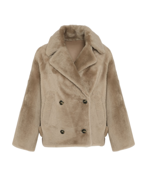 Woman wearing Yves Salomon shearling fur coat – luxury outerwear at Luxury Shoes 