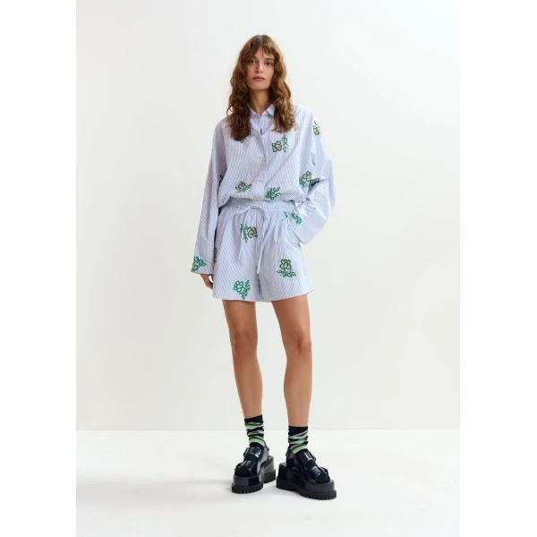 Essentiel Antwerp Off-white cotton mini shorts with light blue pinstriped embroidered with sequin and bead embellishments - Essentiel Antwerp Shorts - Colorful Belgian Design - Shop at Luxury Shoes 