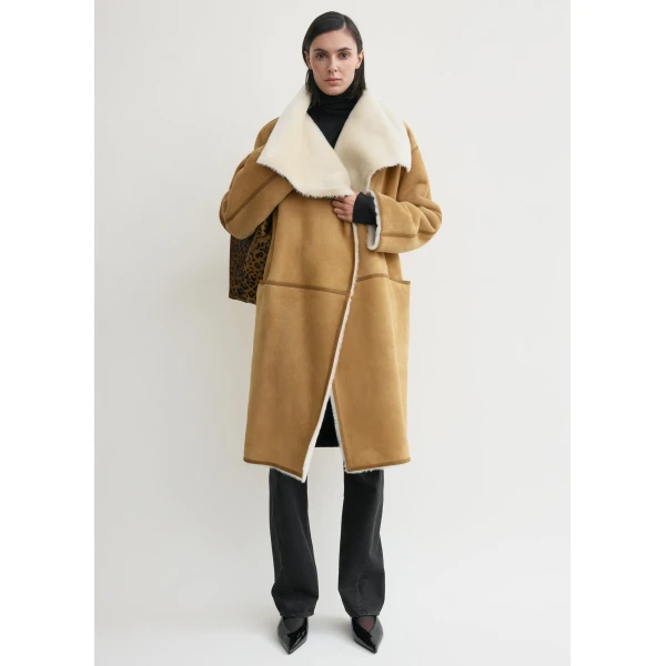 Toteme Coats with minimalist design at Luxury Shoes 