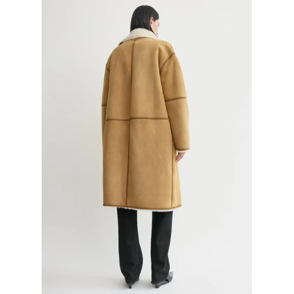 Toteme Coats with minimalist design at Luxury Shoes 