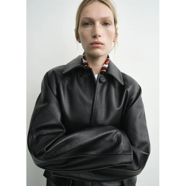 Toteme Coats with minimalist design at Luxury Shoes 