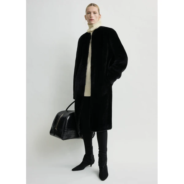 Toteme Coats with minimalist design at Luxury Shoes 