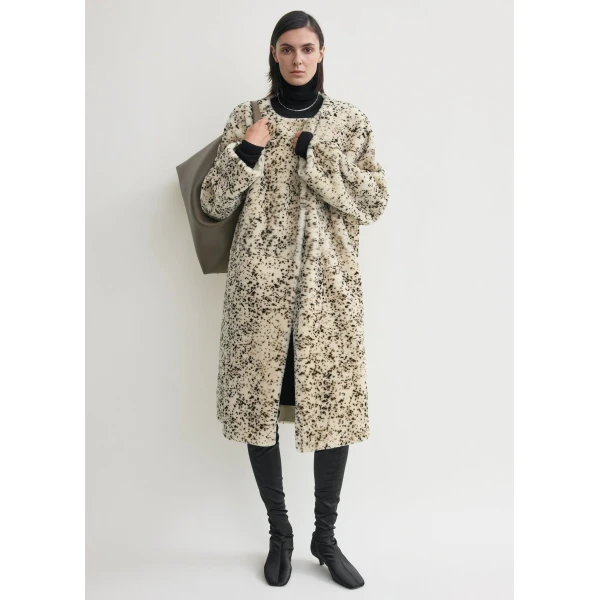 Toteme Coats with minimalist design at Luxury Shoes 