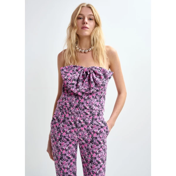 pink and black bustier top with bow