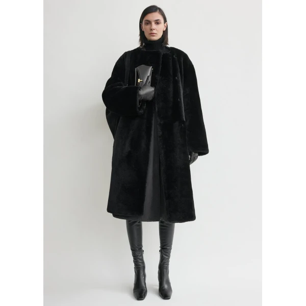 Totême Collarless shearling coat in Black - Coats - Scandinavian Minimalist Luxury at Luxury Shoes 