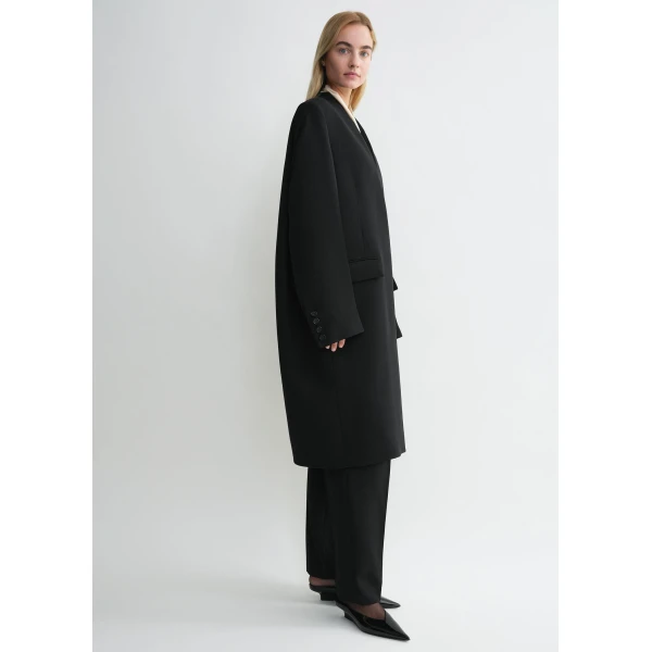 Totême Deep pleat coat in Black - Coats - Scandinavian Minimalist Luxury at Luxury Shoes 