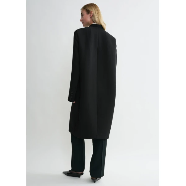 Totême Deep pleat coat in Black - Coats - Scandinavian Minimalist Luxury at Luxury Shoes 