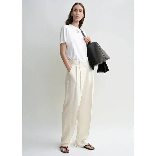 Totême Double-pleat fluid trousers in Ecru - Pants - Scandinavian Minimalist Luxury at Luxury Shoes 