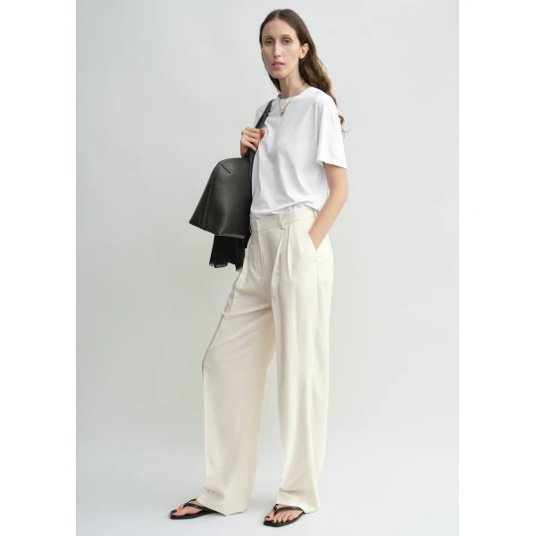Totême Double-pleat fluid trousers in Ecru - Pants - Scandinavian Minimalist Luxury at Luxury Shoes 