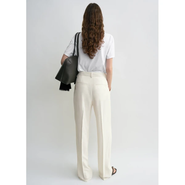 Totême Double-pleat fluid trousers in Ecru - Pants - Scandinavian Minimalist Luxury at Luxury Shoes 