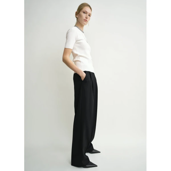 Totême Double-pleat tailored trousers in Black - Pants - Scandinavian Minimalist Luxury at Luxury Shoes 