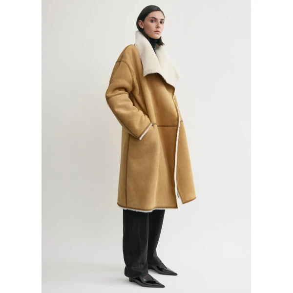 Totême Draped shearling coat in Tan - Coats - Scandinavian Minimalist Luxury at Luxury Shoes 