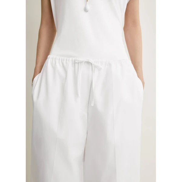 Totême Drawstring cotton trousers in White - Pants - Scandinavian Minimalist Luxury at Luxury Shoes 