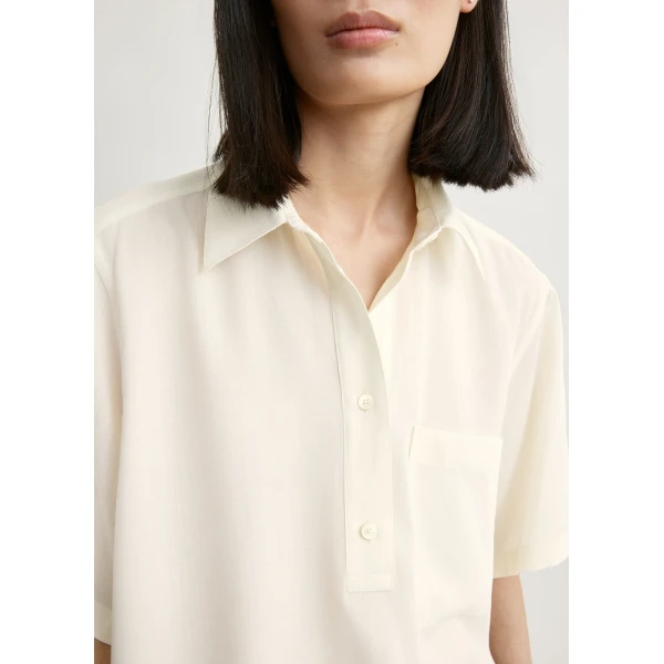 Totême Fluid polo shirt in Ecru - Tops - Scandinavian Minimalist Luxury at Luxury Shoes 