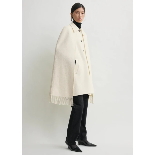 Totême Fringe cape coat in Winter white - Jackets - Scandinavian Minimalist Luxury at Luxury Shoes 