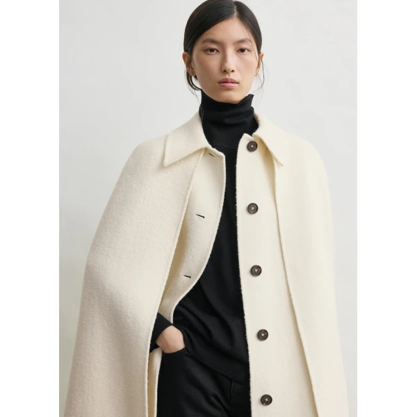 Totême Fringe cape coat in Winter white - Jackets - Scandinavian Minimalist Luxury at Luxury Shoes 