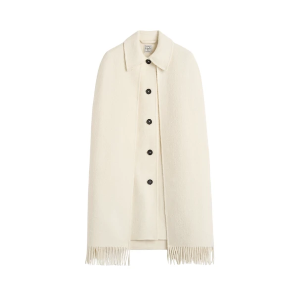 Totême Fringe cape coat in Winter white - Jackets - Scandinavian Minimalist Luxury at Luxury Shoes 