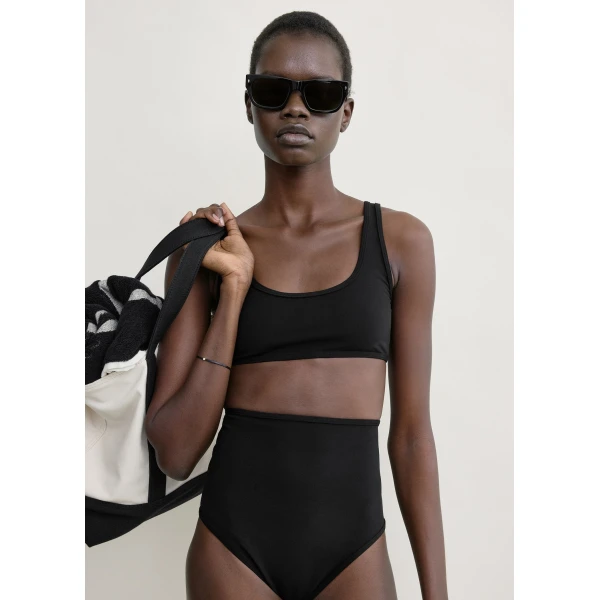 Totême High bikini bottoms in Black - Beachwear - Scandinavian Minimalist Luxury at Luxury Shoes 