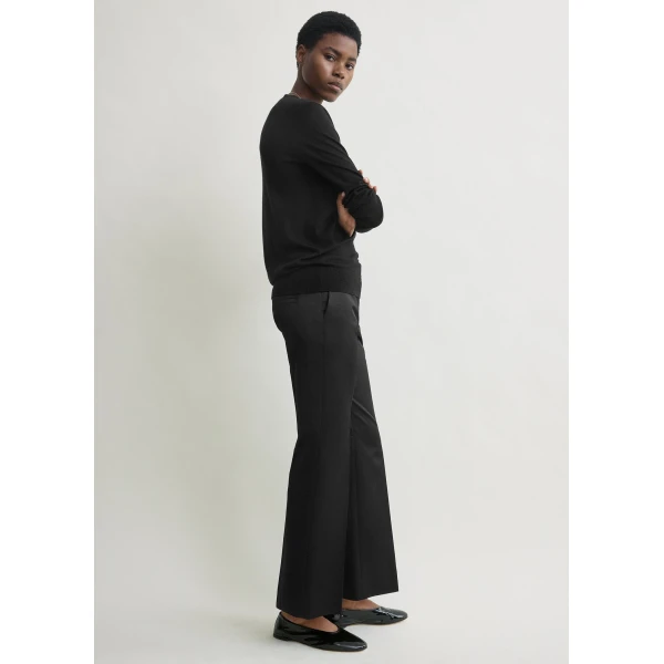 Totême Kick flare raw-edge trousers in Black - Pants - Scandinavian Minimalist Luxury at Luxury Shoes 