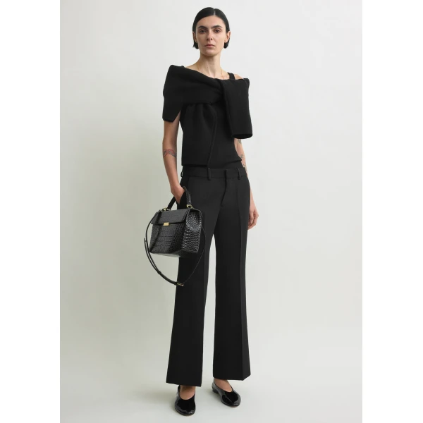 Totême Kick flare trousers in Black - Pants - Scandinavian Minimalist Luxury at Luxury Shoes 