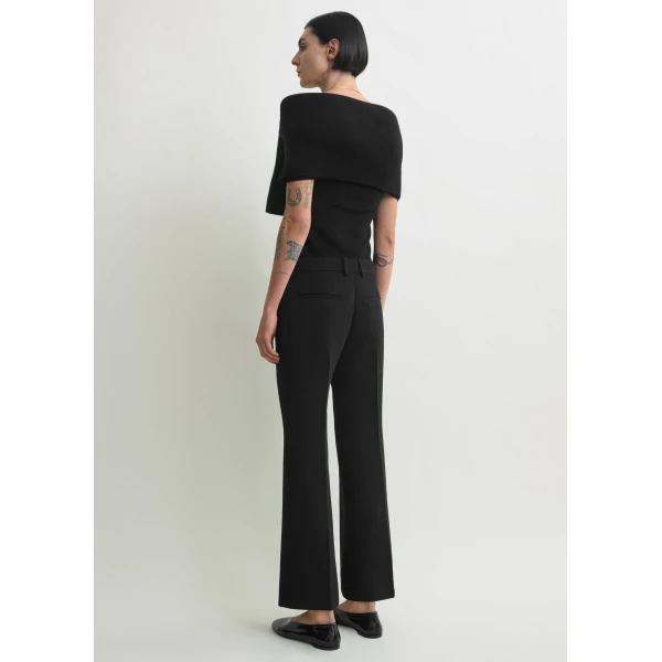 Totême Kick flare trousers in Black - Pants - Scandinavian Minimalist Luxury at Luxury Shoes 