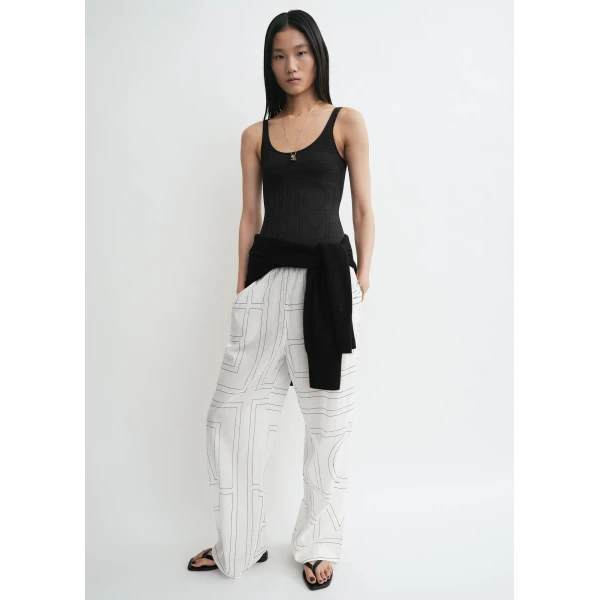 Totême Monogram cotton-blend pj bottoms in White / Black - Pants - Scandinavian Minimalist Luxury at Luxury Shoes 