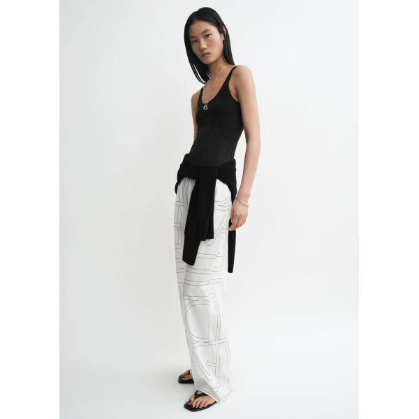 Totême Monogram cotton-blend pj bottoms in White / Black - Pants - Scandinavian Minimalist Luxury at Luxury Shoes 