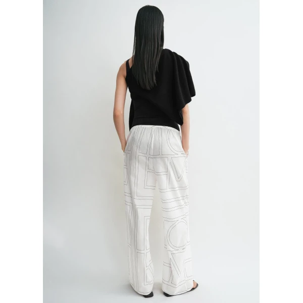 Totême Monogram cotton-blend pj bottoms in White / Black - Pants - Scandinavian Minimalist Luxury at Luxury Shoes 