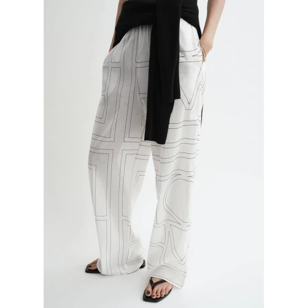 Totême Monogram cotton-blend pj bottoms in White / Black - Pants - Scandinavian Minimalist Luxury at Luxury Shoes 