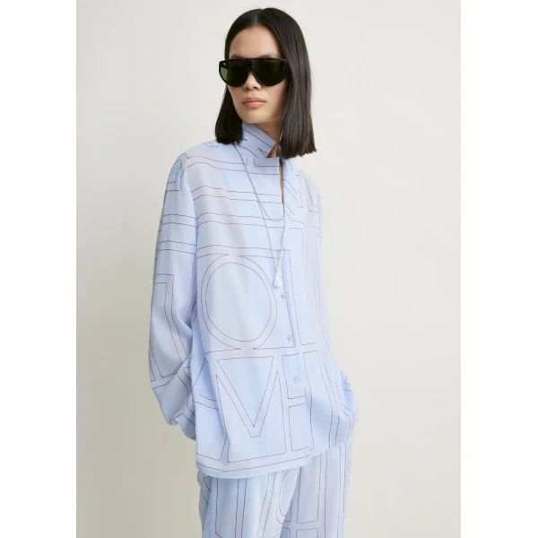 Totême Monogram cotton-blend pj top in Sky - Tops - Scandinavian Minimalist Luxury at Luxury Shoes 