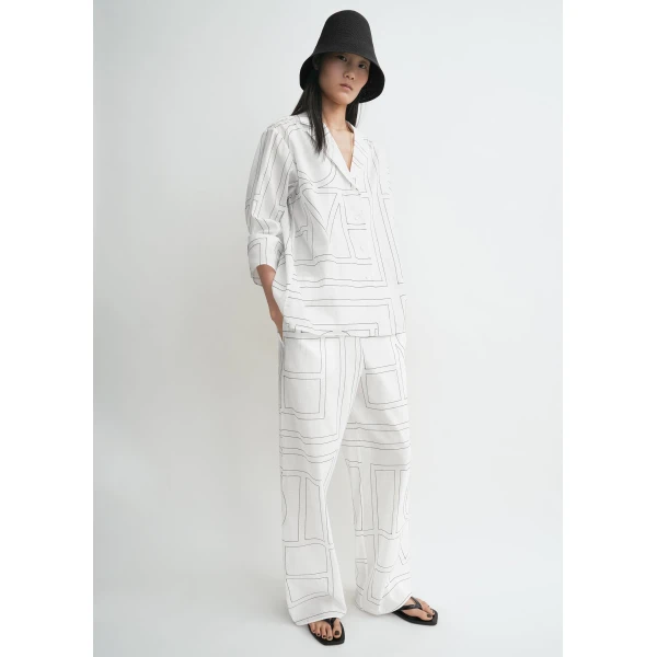 Totême Monogram cotton-blend pj top in White / Black - Tops - Scandinavian Minimalist Luxury at Luxury Shoes 