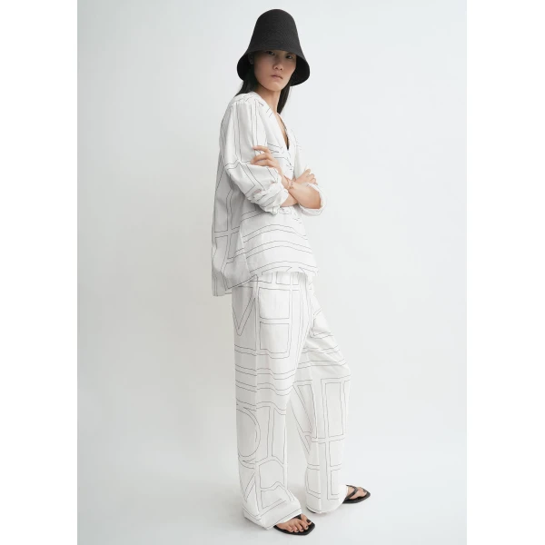 Totême Monogram cotton-blend pj top in White / Black - Tops - Scandinavian Minimalist Luxury at Luxury Shoes 