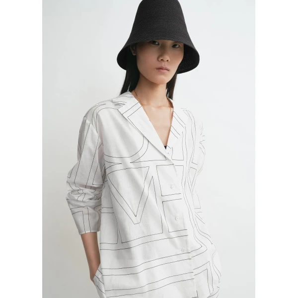 Totême Monogram cotton-blend pj top in White / Black - Tops - Scandinavian Minimalist Luxury at Luxury Shoes 