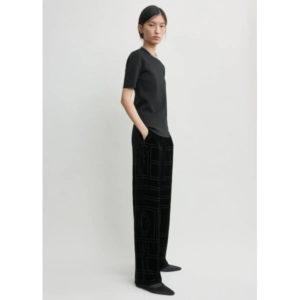 Totême Monogram devoré pj bottoms in Black - Pants - Scandinavian Minimalist Luxury at Luxury Shoes 