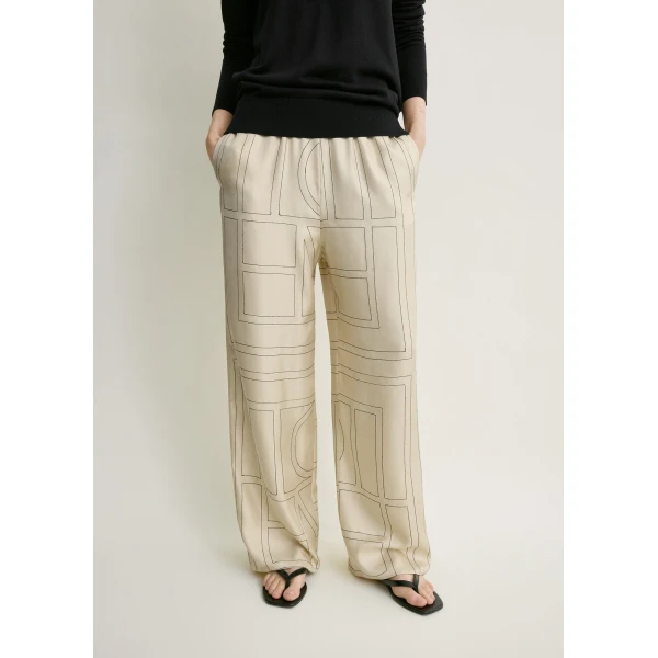Totême Monogram silk pj bottoms ivory in Ivory monogram - Pants - Scandinavian Minimalist Luxury at Luxury Shoes 