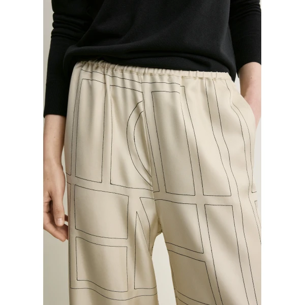 Totême Monogram silk pj bottoms ivory in Ivory monogram - Pants - Scandinavian Minimalist Luxury at Luxury Shoes 