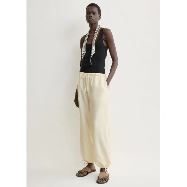 Totême Parachute trousers in Off-white - Pants - Scandinavian Minimalist Luxury at Luxury Shoes 