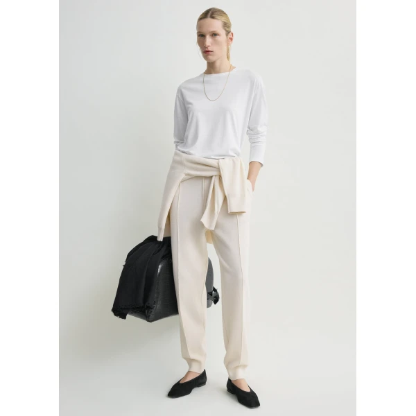 Totême Pintucked sweatpants in Ecru - Pants - Scandinavian Minimalist Luxury at Luxury Shoes 